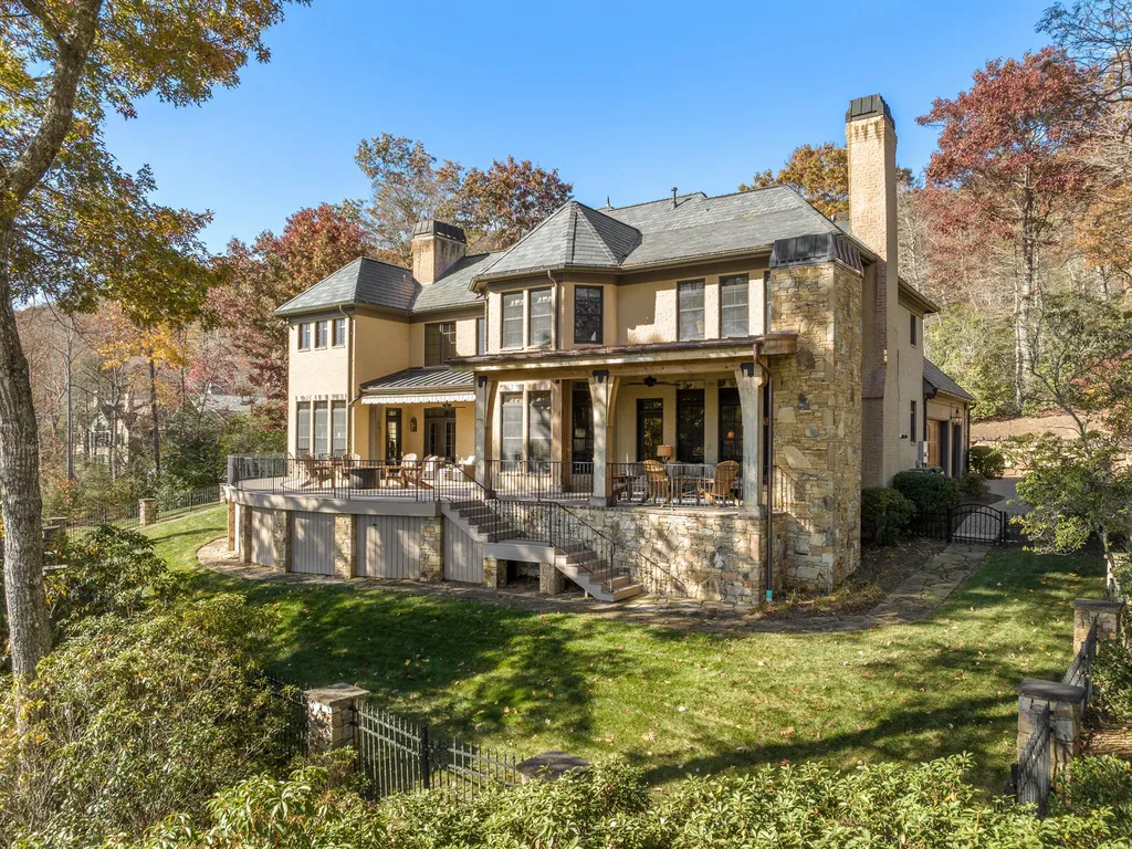 1987 White Tree Trail Home in Arden, North Carolina. Step into luxury living at this exceptional estate home overlooking the signature golf hole at The Cliffs of Walnut Cove. With old-world charm, meticulous details, and stunning mountain views, this residence offers a perfect blend of elegance and golf course living. Indulge in a gourmet kitchen, unique dining experiences, and a serene primary suite.