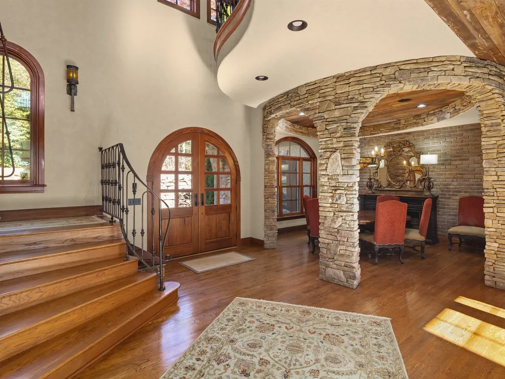 1987 White Tree Trail Home in Arden, North Carolina. Step into luxury living at this exceptional estate home overlooking the signature golf hole at The Cliffs of Walnut Cove. With old-world charm, meticulous details, and stunning mountain views, this residence offers a perfect blend of elegance and golf course living. Indulge in a gourmet kitchen, unique dining experiences, and a serene primary suite.