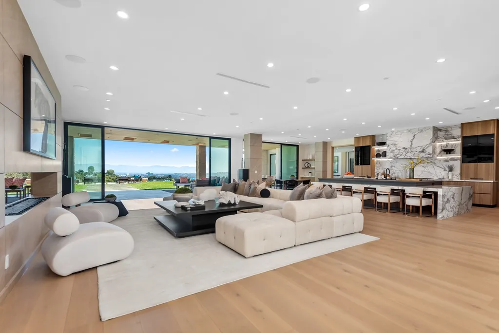 25079 Jim Bridger Road Home in Calabasas, California. Discover the epitome of refined luxury in this stunning new estate on a beautiful 1.6-acre lot in Hidden Hills. The open floor plan features a chef's kitchen, butler's pantry, and expansive great room with sliding walls of glass. Enjoy amenities like a home theater, large game room, and an oversized gym & spa.