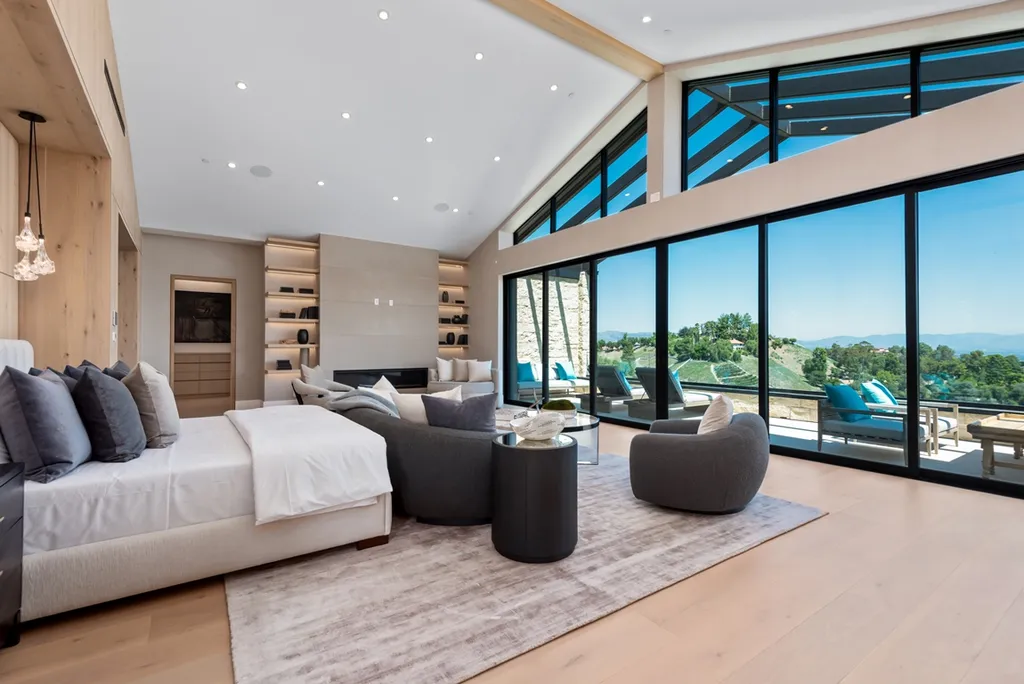 25079 Jim Bridger Road Home in Calabasas, California. Discover the epitome of refined luxury in this stunning new estate on a beautiful 1.6-acre lot in Hidden Hills. The open floor plan features a chef's kitchen, butler's pantry, and expansive great room with sliding walls of glass. Enjoy amenities like a home theater, large game room, and an oversized gym & spa.