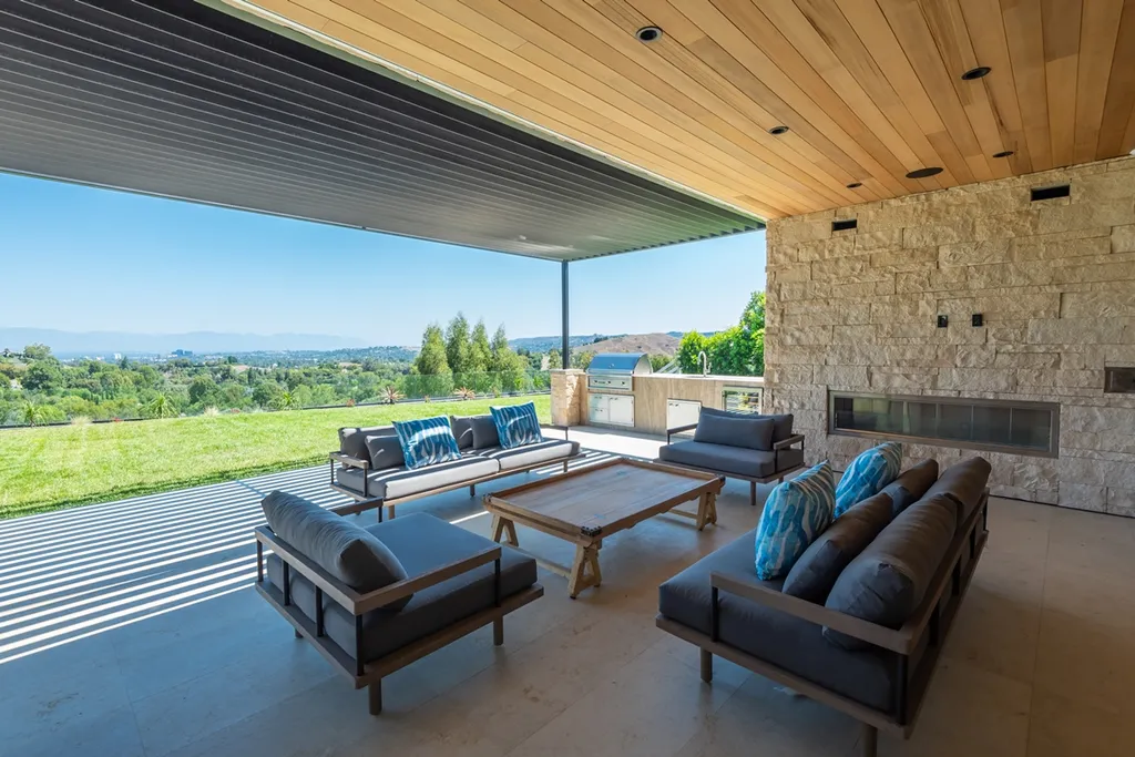 25079 Jim Bridger Road Home in Calabasas, California. Discover the epitome of refined luxury in this stunning new estate on a beautiful 1.6-acre lot in Hidden Hills. The open floor plan features a chef's kitchen, butler's pantry, and expansive great room with sliding walls of glass. Enjoy amenities like a home theater, large game room, and an oversized gym & spa.