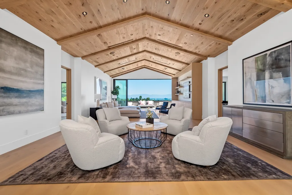 25079 Jim Bridger Road Home in Calabasas, California. Discover the epitome of refined luxury in this stunning new estate on a beautiful 1.6-acre lot in Hidden Hills. The open floor plan features a chef's kitchen, butler's pantry, and expansive great room with sliding walls of glass. Enjoy amenities like a home theater, large game room, and an oversized gym & spa.