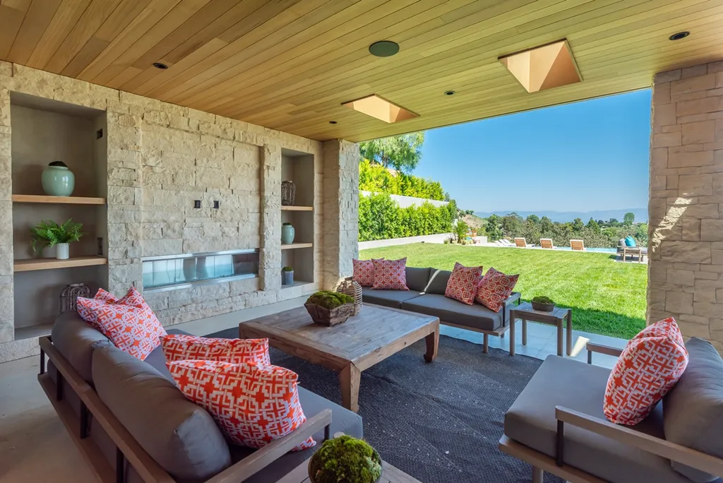 25079 Jim Bridger Road Home in Calabasas, California. Discover the epitome of refined luxury in this stunning new estate on a beautiful 1.6-acre lot in Hidden Hills. The open floor plan features a chef's kitchen, butler's pantry, and expansive great room with sliding walls of glass. Enjoy amenities like a home theater, large game room, and an oversized gym & spa.
