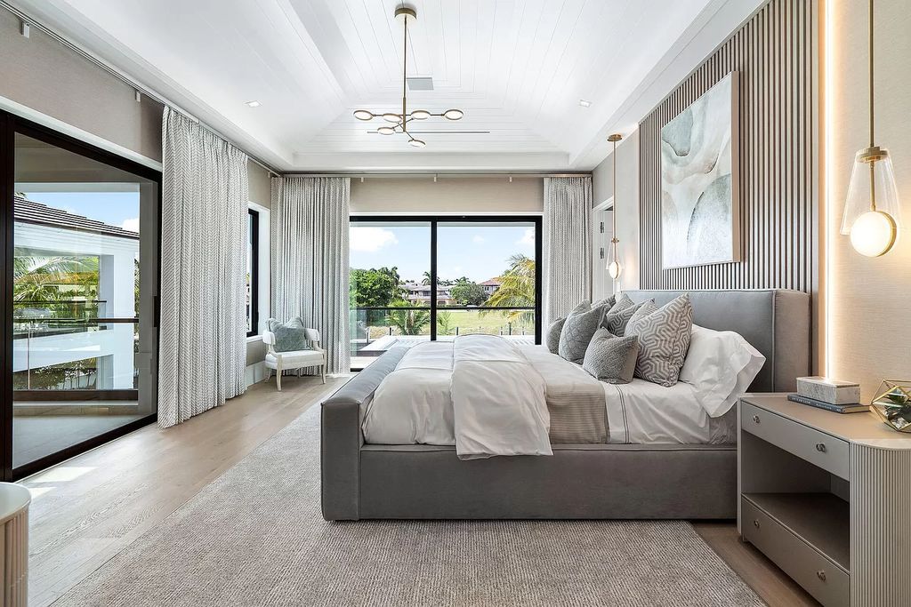 Indulge in the epitome of waterfront luxury at this 10,784-square-foot estate in Royal Palm Yacht & Country Club. Crafted by Wietsma Lippolis Construction, this masterpiece boasts six bedroom suites, expansive living areas curated by Artisan Interiors, and cutting-edge Crestron home technology.