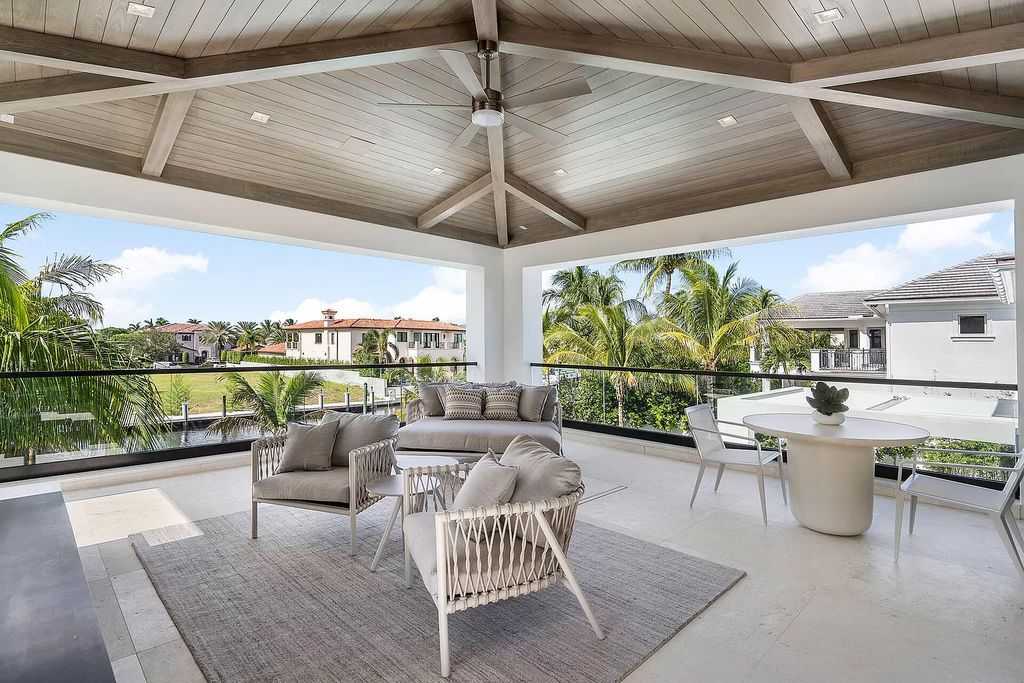 Indulge in the epitome of waterfront luxury at this 10,784-square-foot estate in Royal Palm Yacht & Country Club. Crafted by Wietsma Lippolis Construction, this masterpiece boasts six bedroom suites, expansive living areas curated by Artisan Interiors, and cutting-edge Crestron home technology.
