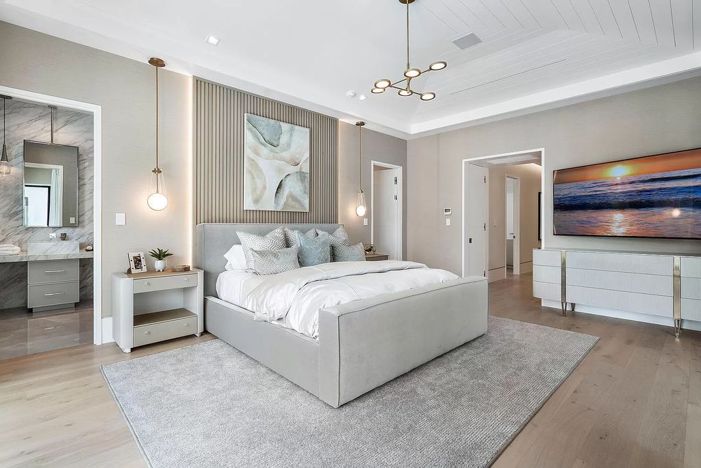 Indulge in the epitome of waterfront luxury at this 10,784-square-foot estate in Royal Palm Yacht & Country Club. Crafted by Wietsma Lippolis Construction, this masterpiece boasts six bedroom suites, expansive living areas curated by Artisan Interiors, and cutting-edge Crestron home technology.