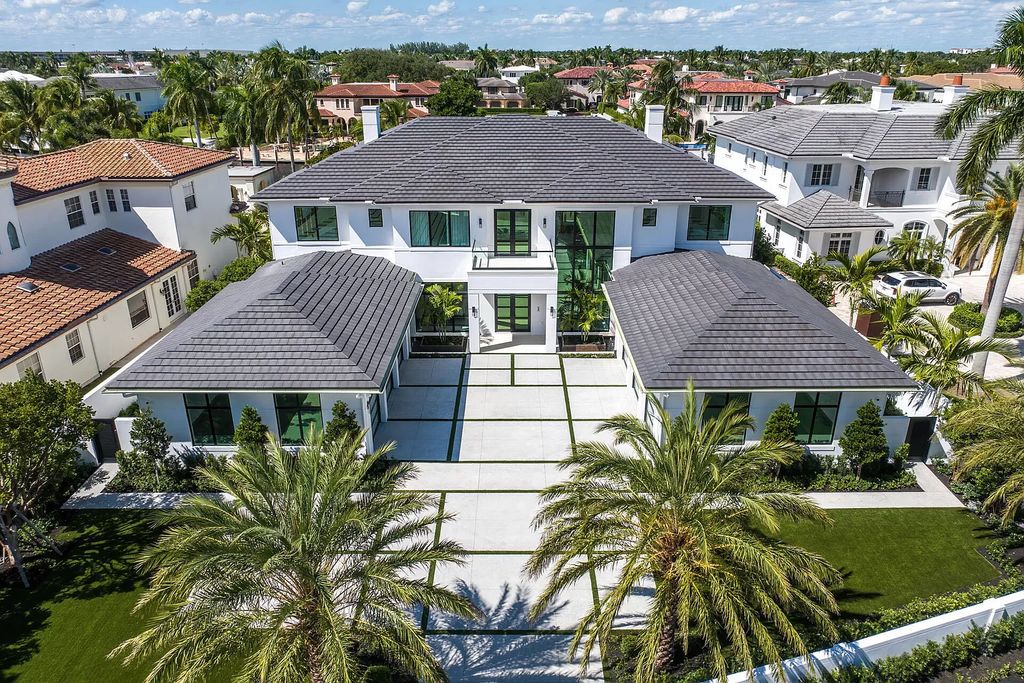 Indulge in the epitome of waterfront luxury at this 10,784-square-foot estate in Royal Palm Yacht & Country Club. Crafted by Wietsma Lippolis Construction, this masterpiece boasts six bedroom suites, expansive living areas curated by Artisan Interiors, and cutting-edge Crestron home technology.