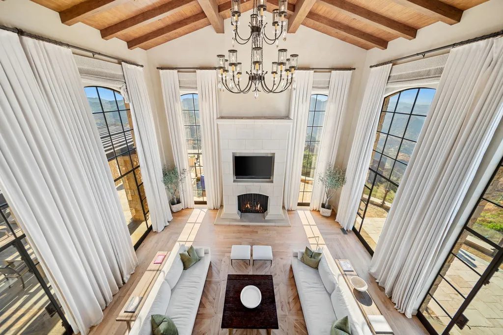 340 North Kanan Dume Road Home in Malibu, California. Perched atop a Malibu Canyon peak, the majestic Malibu Rocky Oaks is a stone-clad Tuscan villa offering unrivaled luxury and panoramic views. This 9,000-square-foot estate boasts 37 picturesque acres, a renowned vineyard, and endless world-class amenities. With a private helipad and infinity pool, this masterpiece redefines the essence of luxury living in the Malibu hills.