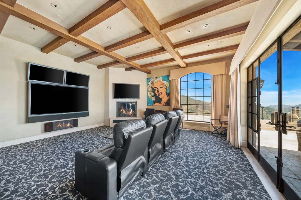 340 North Kanan Dume Road Home in Malibu, California. Perched atop a Malibu Canyon peak, the majestic Malibu Rocky Oaks is a stone-clad Tuscan villa offering unrivaled luxury and panoramic views. This 9,000-square-foot estate boasts 37 picturesque acres, a renowned vineyard, and endless world-class amenities. With a private helipad and infinity pool, this masterpiece redefines the essence of luxury living in the Malibu hills.