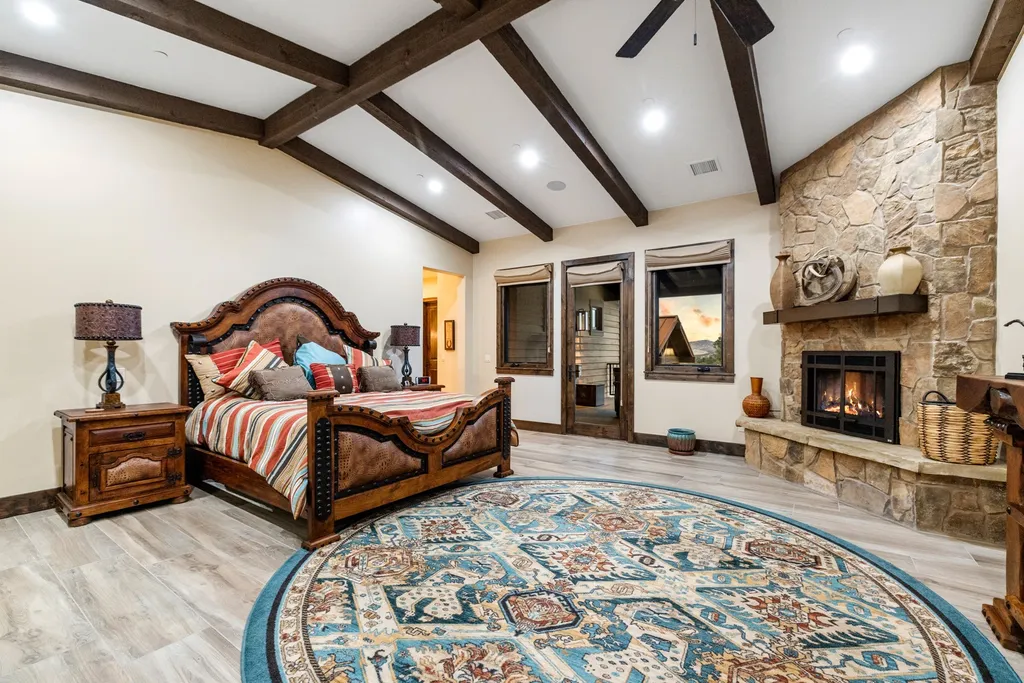 4971 West Three Forks Road Home in Prescott, Arizona. Explore the epitome of luxury living in this privately gated ranch compound with unobstructed views. This 4-bedroom, 5,555 sq.ft home features a 7-car garage, attached guest quarters, private pool with cabana, wet bar, and a 20 ft indoor-outdoor panoramic glass wall door.