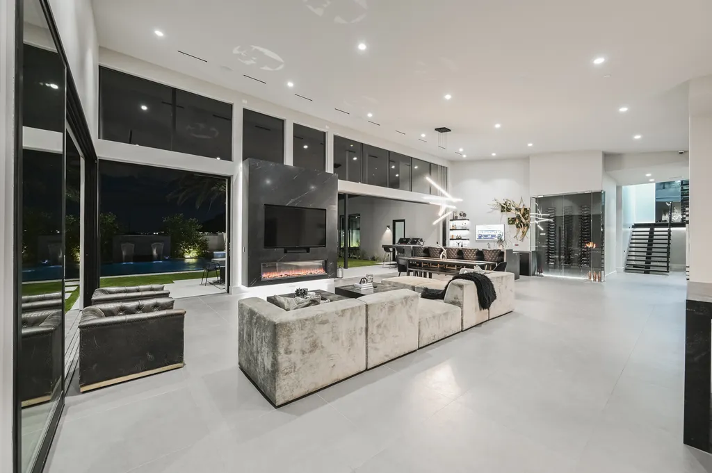 5305 Secluded Brook Court Home in Las Vegas, Nevada. Nestled within the exclusive Serenity Brook Estates at Lone Mountain, this contemporary masterpiece is a true testament to modern luxury living. Situated on a generous half-acre lot, this home offers a seamless fusion of indoor and outdoor spaces.