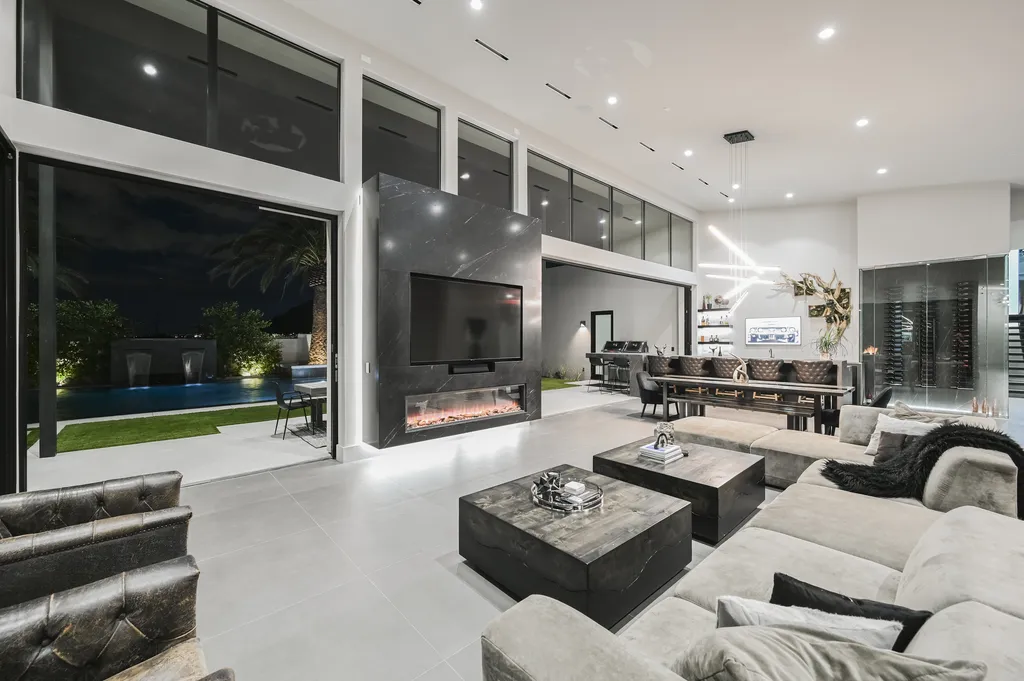 5305 Secluded Brook Court Home in Las Vegas, Nevada. Nestled within the exclusive Serenity Brook Estates at Lone Mountain, this contemporary masterpiece is a true testament to modern luxury living. Situated on a generous half-acre lot, this home offers a seamless fusion of indoor and outdoor spaces.