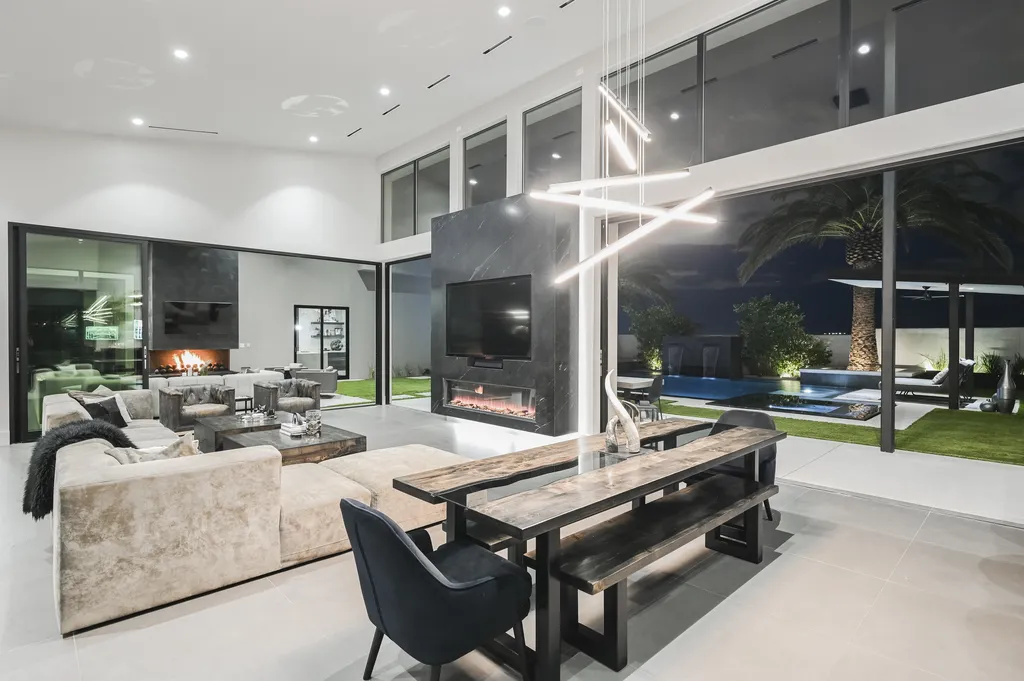 5305 Secluded Brook Court Home in Las Vegas, Nevada. Nestled within the exclusive Serenity Brook Estates at Lone Mountain, this contemporary masterpiece is a true testament to modern luxury living. Situated on a generous half-acre lot, this home offers a seamless fusion of indoor and outdoor spaces.