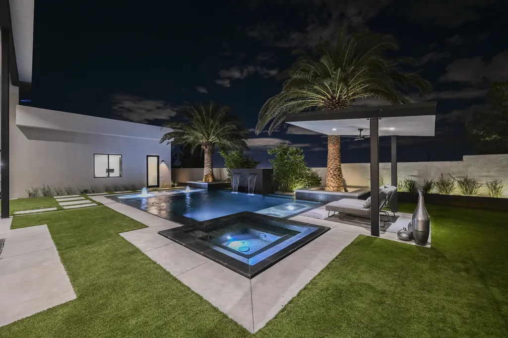 5305 Secluded Brook Court Home in Las Vegas, Nevada. Nestled within the exclusive Serenity Brook Estates at Lone Mountain, this contemporary masterpiece is a true testament to modern luxury living. Situated on a generous half-acre lot, this home offers a seamless fusion of indoor and outdoor spaces.