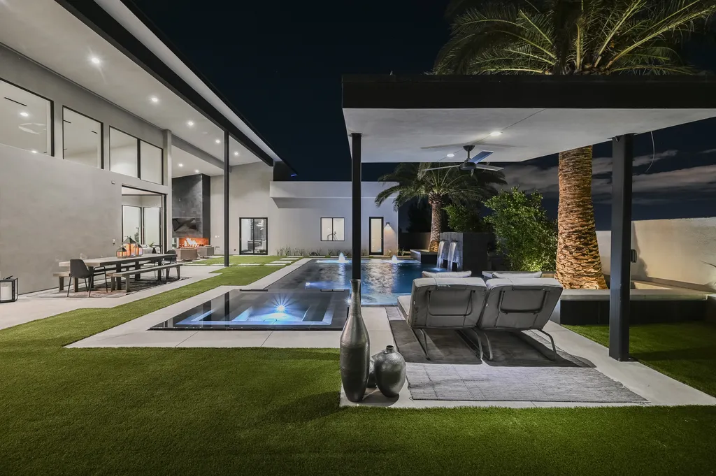 5305 Secluded Brook Court Home in Las Vegas, Nevada. Nestled within the exclusive Serenity Brook Estates at Lone Mountain, this contemporary masterpiece is a true testament to modern luxury living. Situated on a generous half-acre lot, this home offers a seamless fusion of indoor and outdoor spaces.