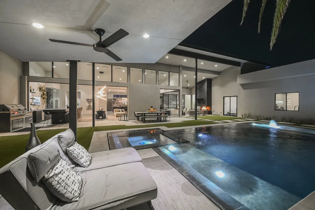 5305 Secluded Brook Court Home in Las Vegas, Nevada. Nestled within the exclusive Serenity Brook Estates at Lone Mountain, this contemporary masterpiece is a true testament to modern luxury living. Situated on a generous half-acre lot, this home offers a seamless fusion of indoor and outdoor spaces.
