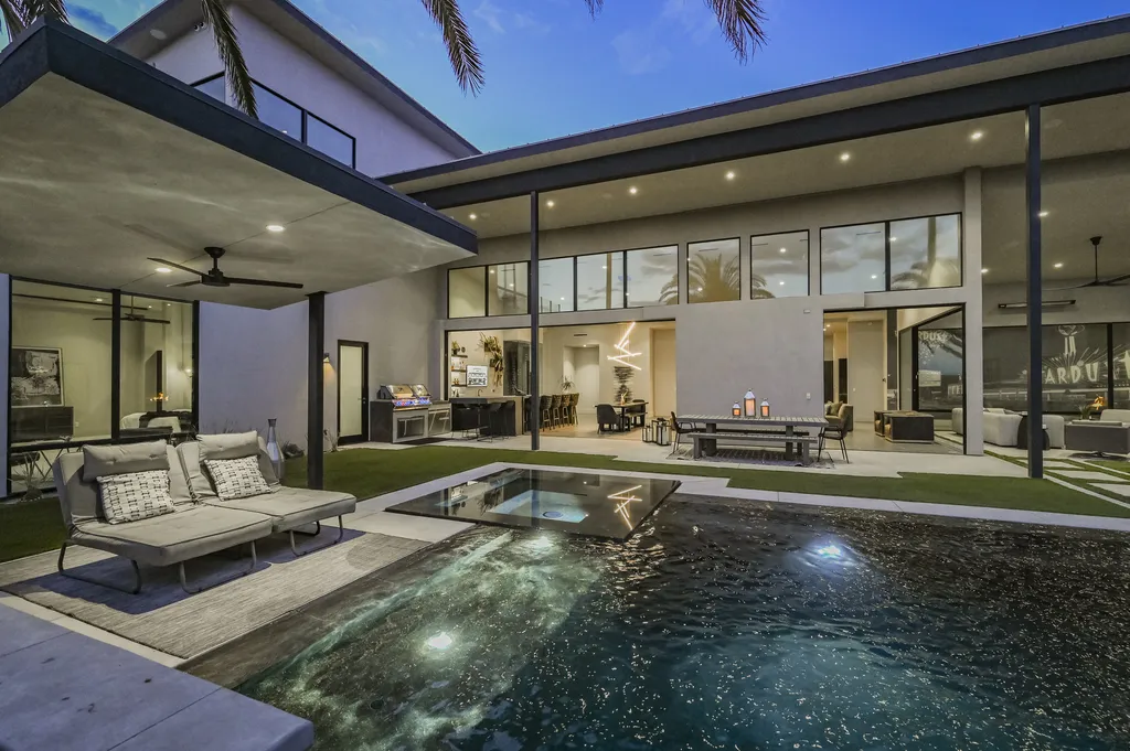 5305 Secluded Brook Court Home in Las Vegas, Nevada. Nestled within the exclusive Serenity Brook Estates at Lone Mountain, this contemporary masterpiece is a true testament to modern luxury living. Situated on a generous half-acre lot, this home offers a seamless fusion of indoor and outdoor spaces.