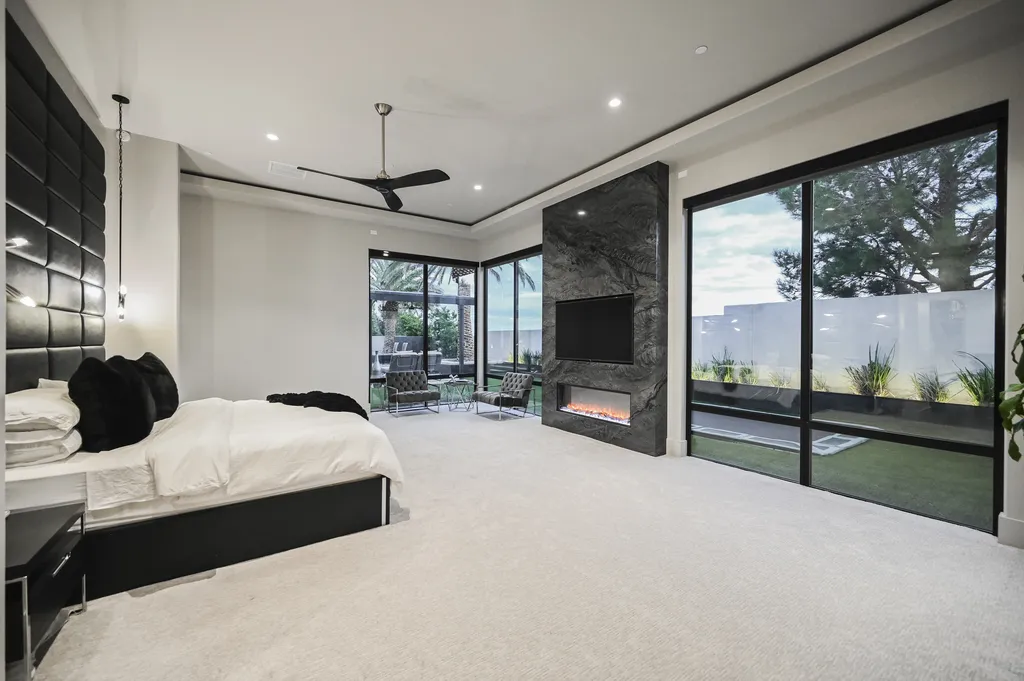 5305 Secluded Brook Court Home in Las Vegas, Nevada. Nestled within the exclusive Serenity Brook Estates at Lone Mountain, this contemporary masterpiece is a true testament to modern luxury living. Situated on a generous half-acre lot, this home offers a seamless fusion of indoor and outdoor spaces.