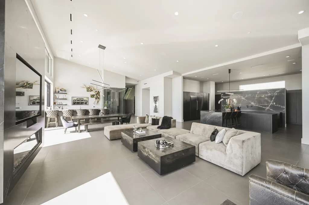 5305 Secluded Brook Court Home in Las Vegas, Nevada. Nestled within the exclusive Serenity Brook Estates at Lone Mountain, this contemporary masterpiece is a true testament to modern luxury living. Situated on a generous half-acre lot, this home offers a seamless fusion of indoor and outdoor spaces.