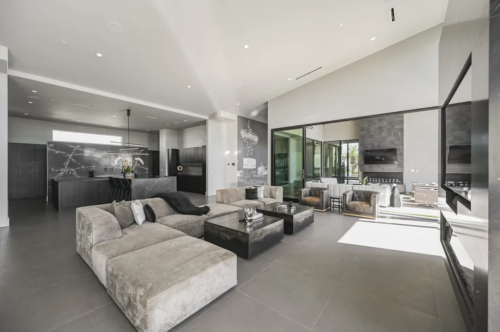 5305 Secluded Brook Court Home in Las Vegas, Nevada. Nestled within the exclusive Serenity Brook Estates at Lone Mountain, this contemporary masterpiece is a true testament to modern luxury living. Situated on a generous half-acre lot, this home offers a seamless fusion of indoor and outdoor spaces.