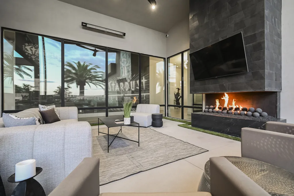 5305 Secluded Brook Court Home in Las Vegas, Nevada. Nestled within the exclusive Serenity Brook Estates at Lone Mountain, this contemporary masterpiece is a true testament to modern luxury living. Situated on a generous half-acre lot, this home offers a seamless fusion of indoor and outdoor spaces.