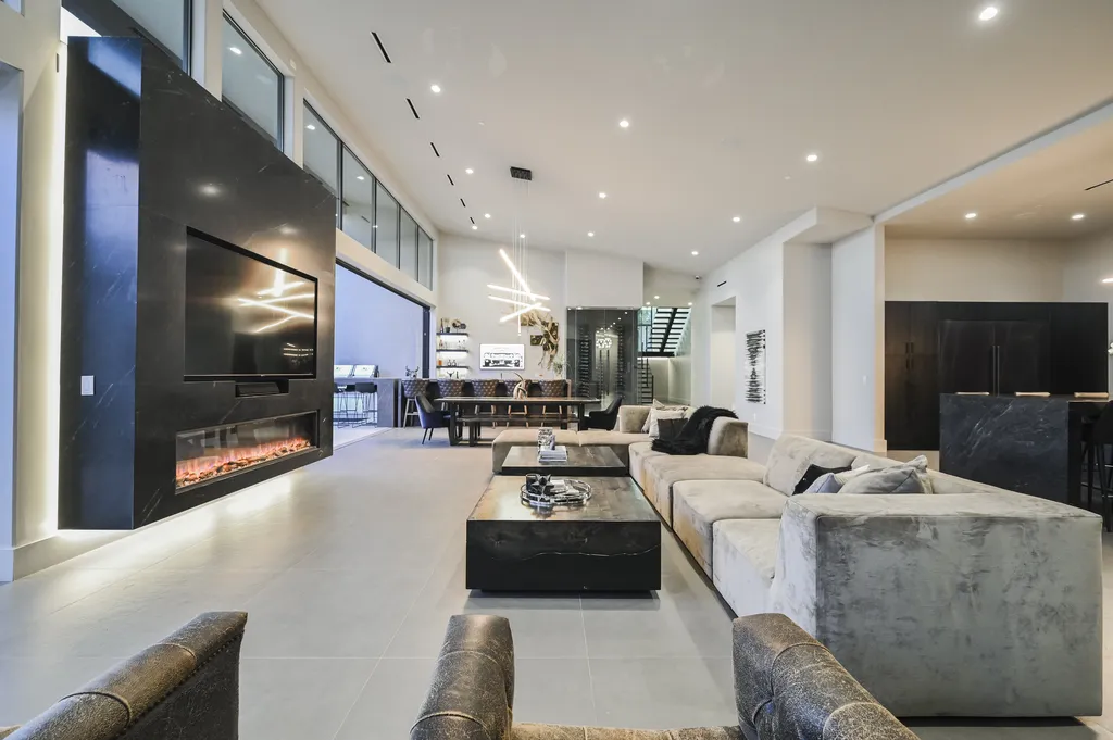 5305 Secluded Brook Court Home in Las Vegas, Nevada. Nestled within the exclusive Serenity Brook Estates at Lone Mountain, this contemporary masterpiece is a true testament to modern luxury living. Situated on a generous half-acre lot, this home offers a seamless fusion of indoor and outdoor spaces.
