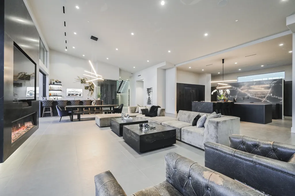 5305 Secluded Brook Court Home in Las Vegas, Nevada. Nestled within the exclusive Serenity Brook Estates at Lone Mountain, this contemporary masterpiece is a true testament to modern luxury living. Situated on a generous half-acre lot, this home offers a seamless fusion of indoor and outdoor spaces.