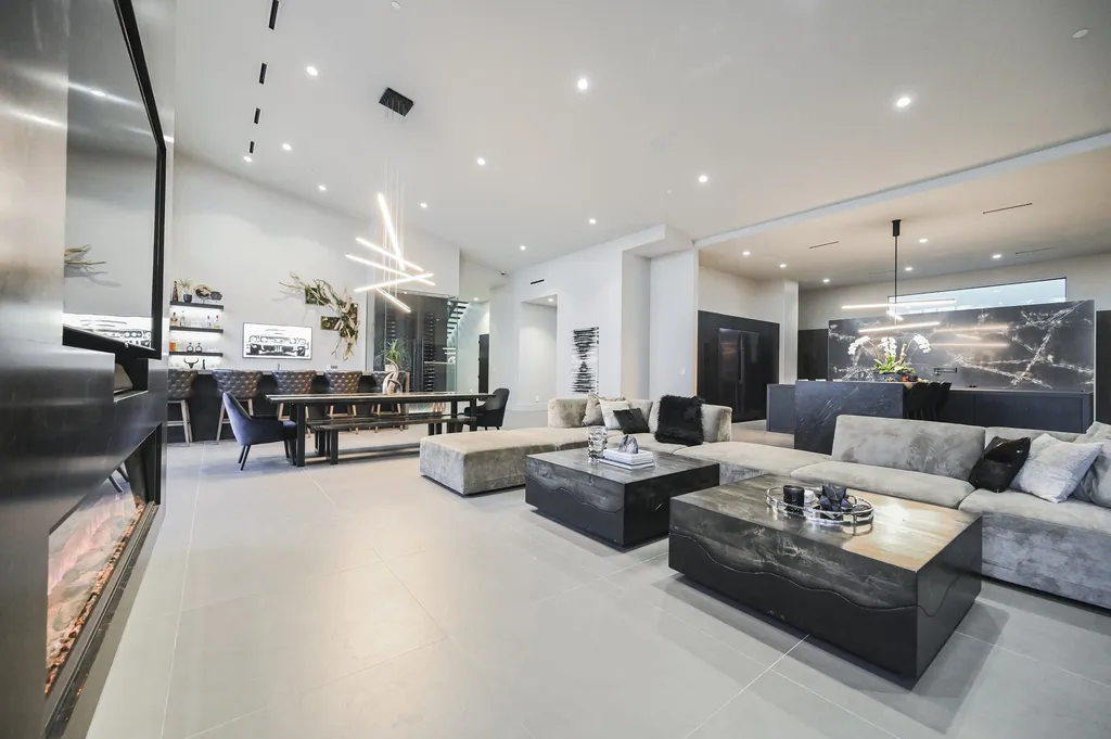 5305 Secluded Brook Court Home in Las Vegas, Nevada. Nestled within the exclusive Serenity Brook Estates at Lone Mountain, this contemporary masterpiece is a true testament to modern luxury living. Situated on a generous half-acre lot, this home offers a seamless fusion of indoor and outdoor spaces.