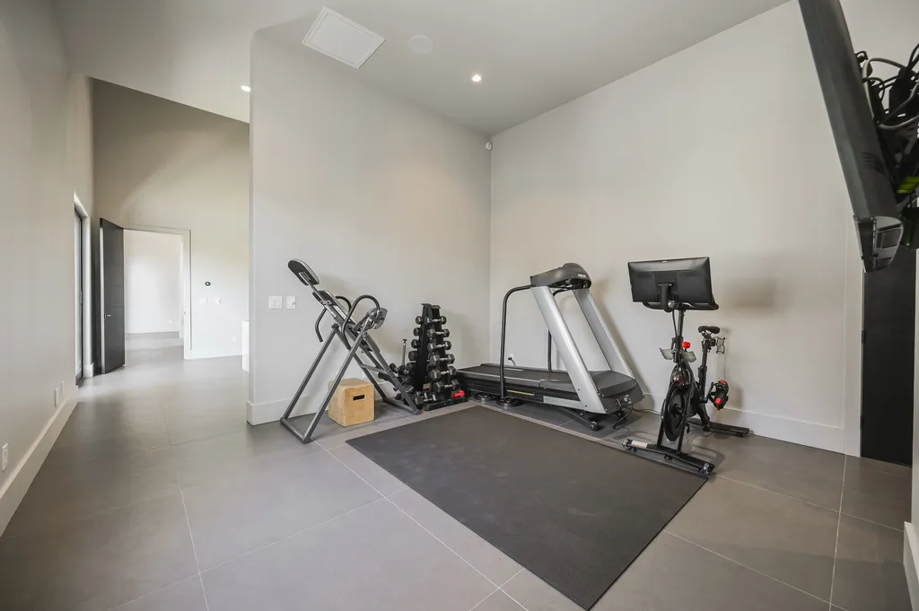 5305 Secluded Brook Court Home in Las Vegas, Nevada. Nestled within the exclusive Serenity Brook Estates at Lone Mountain, this contemporary masterpiece is a true testament to modern luxury living. Situated on a generous half-acre lot, this home offers a seamless fusion of indoor and outdoor spaces.