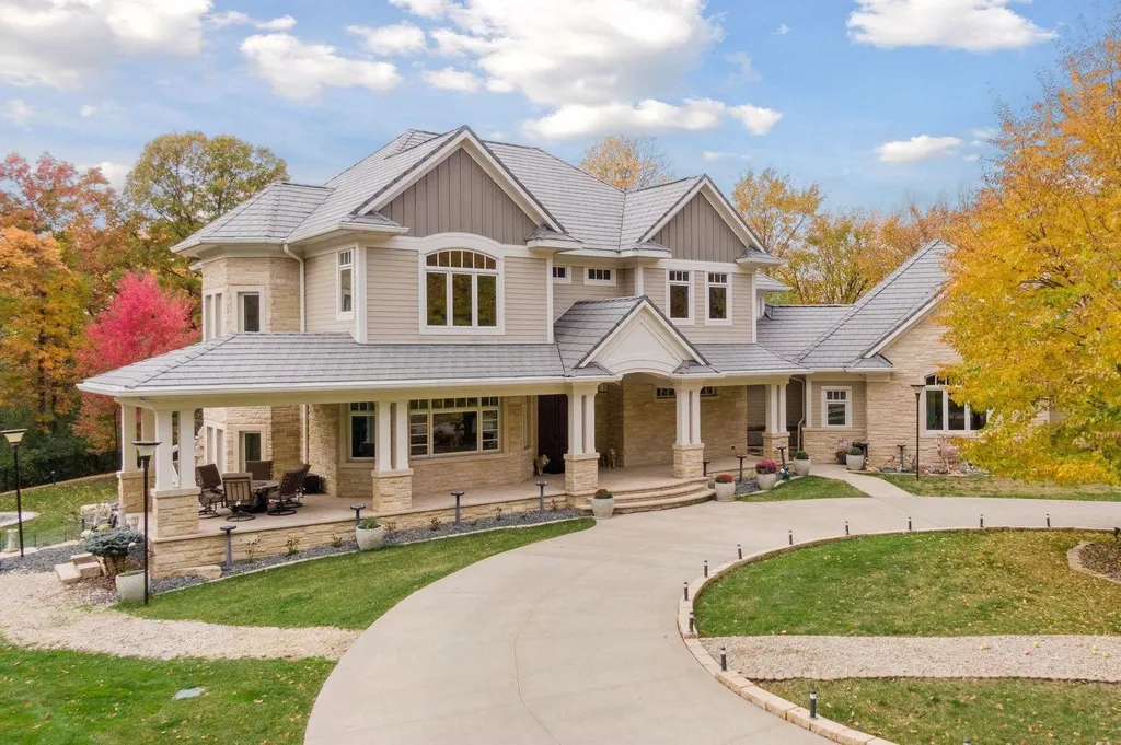 5790 Jasmine Lane SW Home in Rochester, Minnesota. Discover unparalleled luxury in this 11,000 SF architectural masterpiece by renowned architect John McMiller. Nestled on a private lot, this smart home is a blend of elegance and technology, featuring a pool deck, theater room, and heated floors throughout.