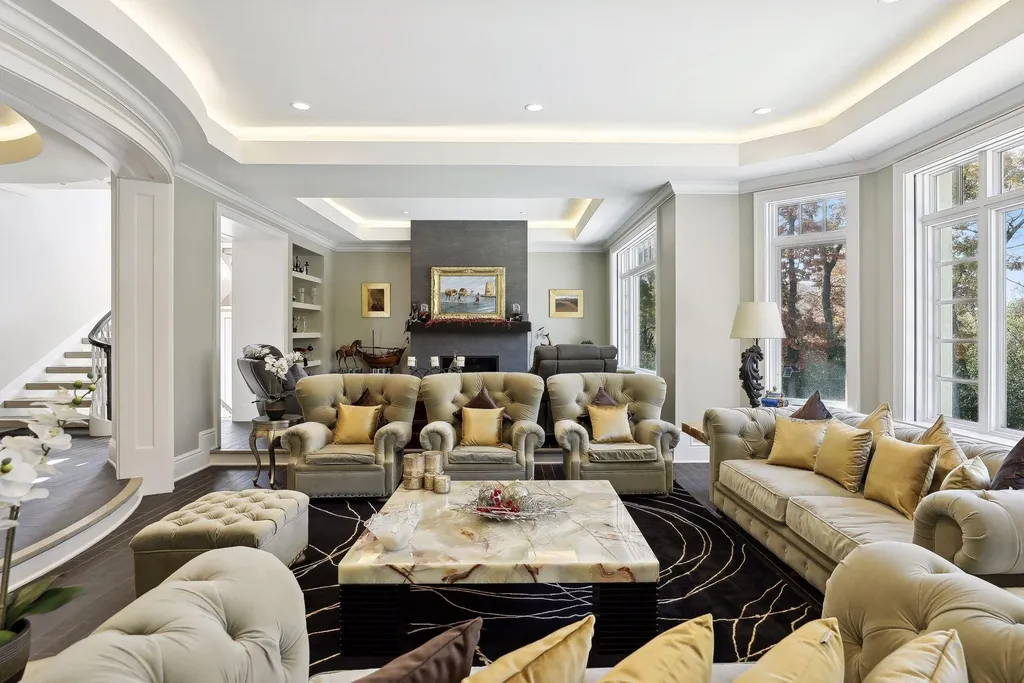5790 Jasmine Lane SW Home in Rochester, Minnesota. Discover unparalleled luxury in this 11,000 SF architectural masterpiece by renowned architect John McMiller. Nestled on a private lot, this smart home is a blend of elegance and technology, featuring a pool deck, theater room, and heated floors throughout.