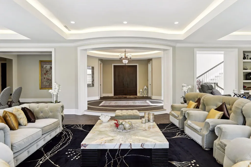 5790 Jasmine Lane SW Home in Rochester, Minnesota. Discover unparalleled luxury in this 11,000 SF architectural masterpiece by renowned architect John McMiller. Nestled on a private lot, this smart home is a blend of elegance and technology, featuring a pool deck, theater room, and heated floors throughout.
