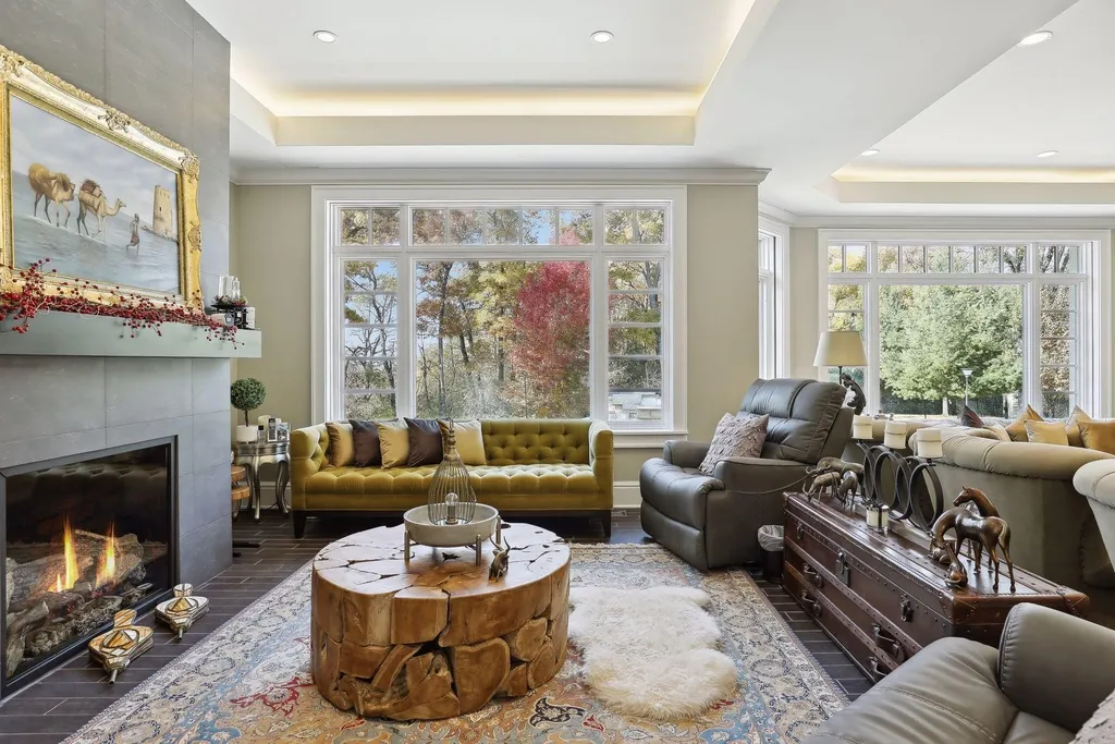 5790 Jasmine Lane SW Home in Rochester, Minnesota. Discover unparalleled luxury in this 11,000 SF architectural masterpiece by renowned architect John McMiller. Nestled on a private lot, this smart home is a blend of elegance and technology, featuring a pool deck, theater room, and heated floors throughout.