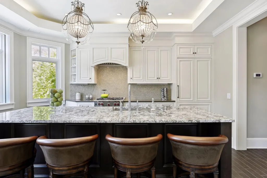 5790 Jasmine Lane SW Home in Rochester, Minnesota. Discover unparalleled luxury in this 11,000 SF architectural masterpiece by renowned architect John McMiller. Nestled on a private lot, this smart home is a blend of elegance and technology, featuring a pool deck, theater room, and heated floors throughout.