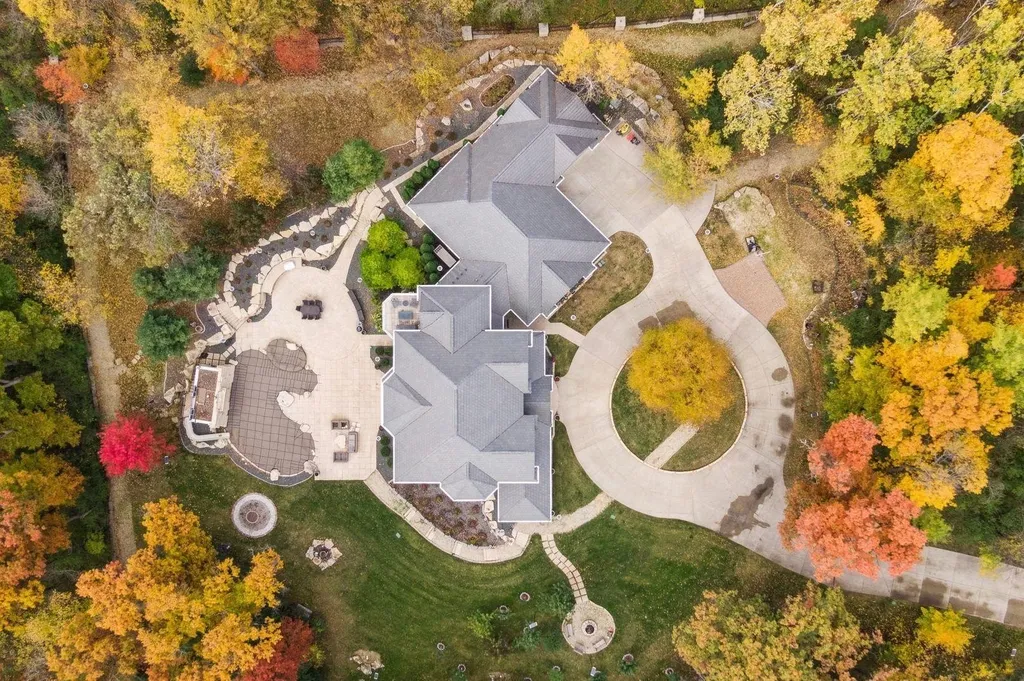 5790 Jasmine Lane SW Home in Rochester, Minnesota. Discover unparalleled luxury in this 11,000 SF architectural masterpiece by renowned architect John McMiller. Nestled on a private lot, this smart home is a blend of elegance and technology, featuring a pool deck, theater room, and heated floors throughout.