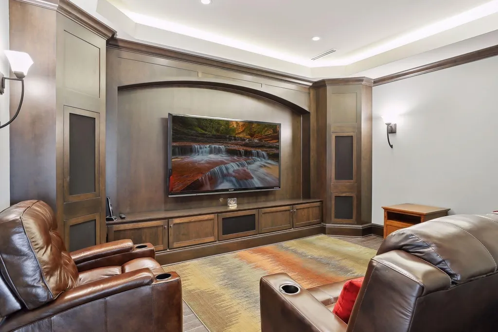 5790 Jasmine Lane SW Home in Rochester, Minnesota. Discover unparalleled luxury in this 11,000 SF architectural masterpiece by renowned architect John McMiller. Nestled on a private lot, this smart home is a blend of elegance and technology, featuring a pool deck, theater room, and heated floors throughout.