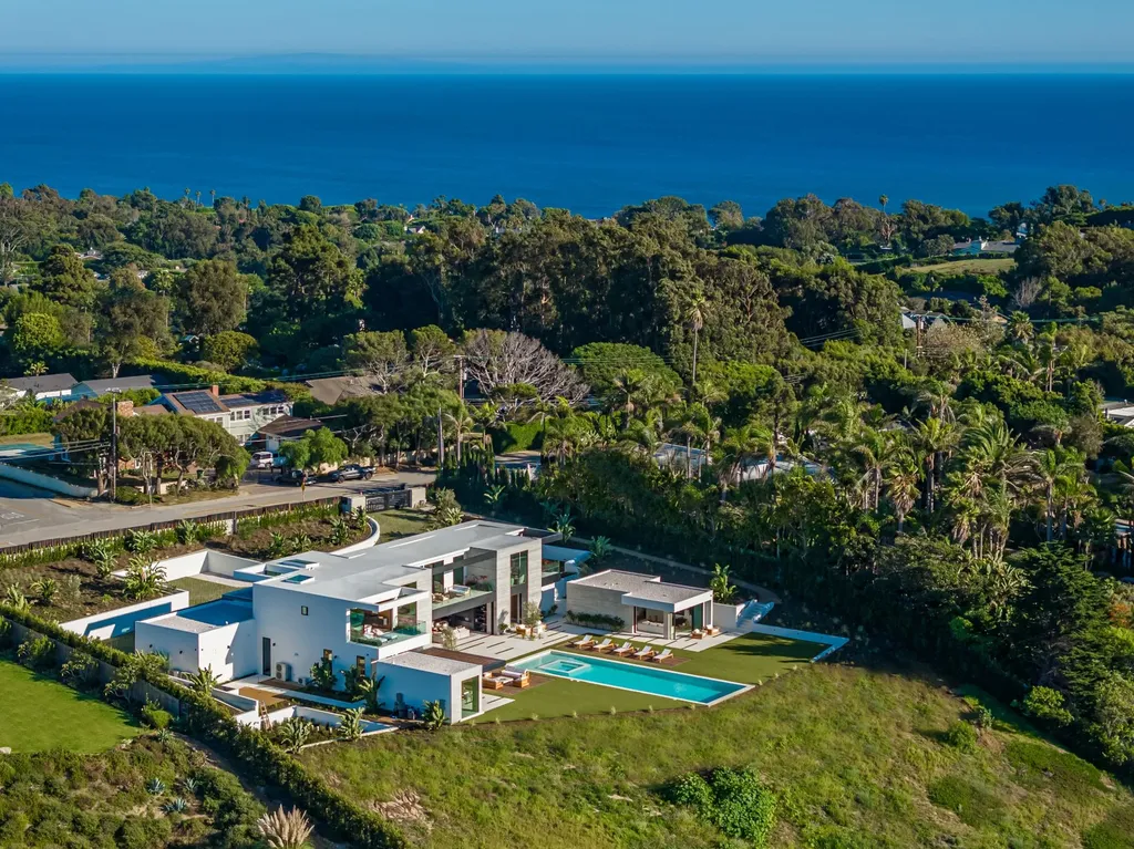 6889 Dume Drive Home in Malibu, California. Immerse yourself in the epitome of Malibu living with this newly completed 8,500 SF modern organic retreat in Little Dume. Developed and designed by Charles Kotliar and architect Doug Burdge, this ocean-view oasis offers 6 BD, 8 BA, customizations like board form concrete walls, oak woods, and curated stones. 