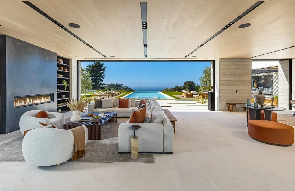 6889 Dume Drive Home in Malibu, California. Immerse yourself in the epitome of Malibu living with this newly completed 8,500 SF modern organic retreat in Little Dume. Developed and designed by Charles Kotliar and architect Doug Burdge, this ocean-view oasis offers 6 BD, 8 BA, customizations like board form concrete walls, oak woods, and curated stones. 