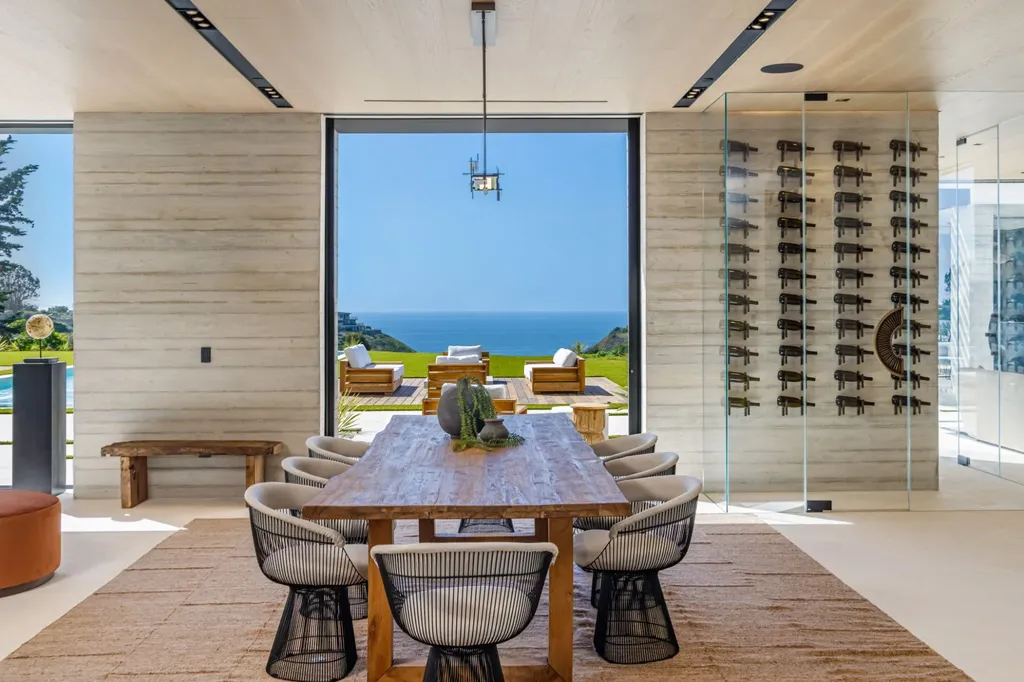6889 Dume Drive Home in Malibu, California. Immerse yourself in the epitome of Malibu living with this newly completed 8,500 SF modern organic retreat in Little Dume. Developed and designed by Charles Kotliar and architect Doug Burdge, this ocean-view oasis offers 6 BD, 8 BA, customizations like board form concrete walls, oak woods, and curated stones. 