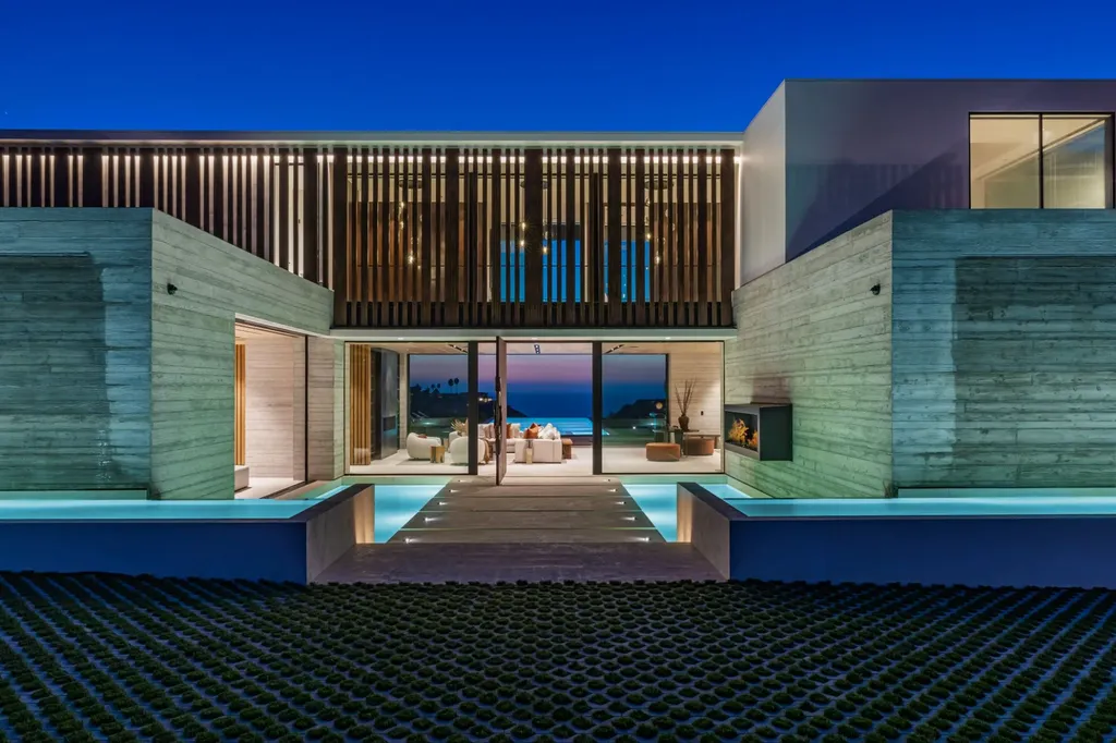 6889 Dume Drive Home in Malibu, California. Immerse yourself in the epitome of Malibu living with this newly completed 8,500 SF modern organic retreat in Little Dume. Developed and designed by Charles Kotliar and architect Doug Burdge, this ocean-view oasis offers 6 BD, 8 BA, customizations like board form concrete walls, oak woods, and curated stones. 