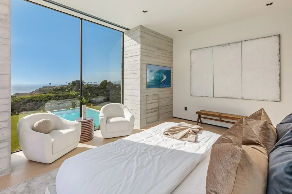 6889 Dume Drive Home in Malibu, California. Immerse yourself in the epitome of Malibu living with this newly completed 8,500 SF modern organic retreat in Little Dume. Developed and designed by Charles Kotliar and architect Doug Burdge, this ocean-view oasis offers 6 BD, 8 BA, customizations like board form concrete walls, oak woods, and curated stones. 