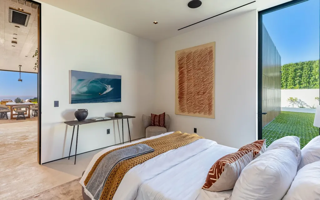 6889 Dume Drive Home in Malibu, California. Immerse yourself in the epitome of Malibu living with this newly completed 8,500 SF modern organic retreat in Little Dume. Developed and designed by Charles Kotliar and architect Doug Burdge, this ocean-view oasis offers 6 BD, 8 BA, customizations like board form concrete walls, oak woods, and curated stones. 