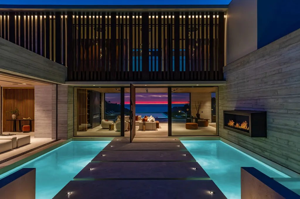6889 Dume Drive Home in Malibu, California. Immerse yourself in the epitome of Malibu living with this newly completed 8,500 SF modern organic retreat in Little Dume. Developed and designed by Charles Kotliar and architect Doug Burdge, this ocean-view oasis offers 6 BD, 8 BA, customizations like board form concrete walls, oak woods, and curated stones. 