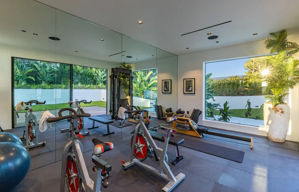 6889 Dume Drive Home in Malibu, California. Immerse yourself in the epitome of Malibu living with this newly completed 8,500 SF modern organic retreat in Little Dume. Developed and designed by Charles Kotliar and architect Doug Burdge, this ocean-view oasis offers 6 BD, 8 BA, customizations like board form concrete walls, oak woods, and curated stones. 