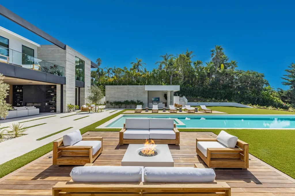 6889 Dume Drive Home in Malibu, California. Immerse yourself in the epitome of Malibu living with this newly completed 8,500 SF modern organic retreat in Little Dume. Developed and designed by Charles Kotliar and architect Doug Burdge, this ocean-view oasis offers 6 BD, 8 BA, customizations like board form concrete walls, oak woods, and curated stones. 