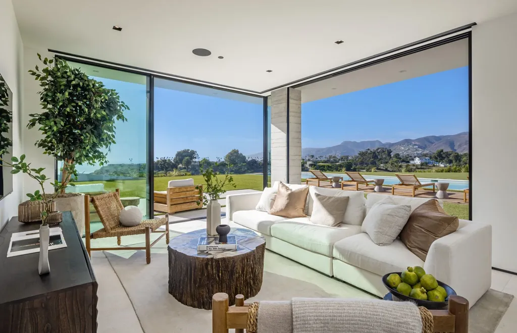6889 Dume Drive Home in Malibu, California. Immerse yourself in the epitome of Malibu living with this newly completed 8,500 SF modern organic retreat in Little Dume. Developed and designed by Charles Kotliar and architect Doug Burdge, this ocean-view oasis offers 6 BD, 8 BA, customizations like board form concrete walls, oak woods, and curated stones. 