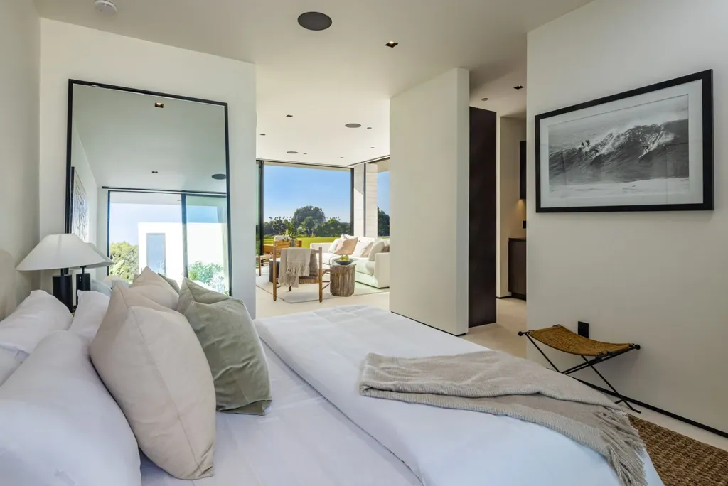 6889 Dume Drive Home in Malibu, California. Immerse yourself in the epitome of Malibu living with this newly completed 8,500 SF modern organic retreat in Little Dume. Developed and designed by Charles Kotliar and architect Doug Burdge, this ocean-view oasis offers 6 BD, 8 BA, customizations like board form concrete walls, oak woods, and curated stones. 