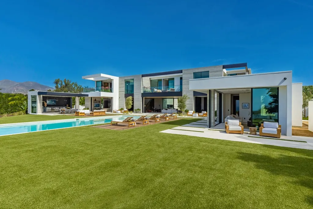 6889 Dume Drive Home in Malibu, California. Immerse yourself in the epitome of Malibu living with this newly completed 8,500 SF modern organic retreat in Little Dume. Developed and designed by Charles Kotliar and architect Doug Burdge, this ocean-view oasis offers 6 BD, 8 BA, customizations like board form concrete walls, oak woods, and curated stones. 
