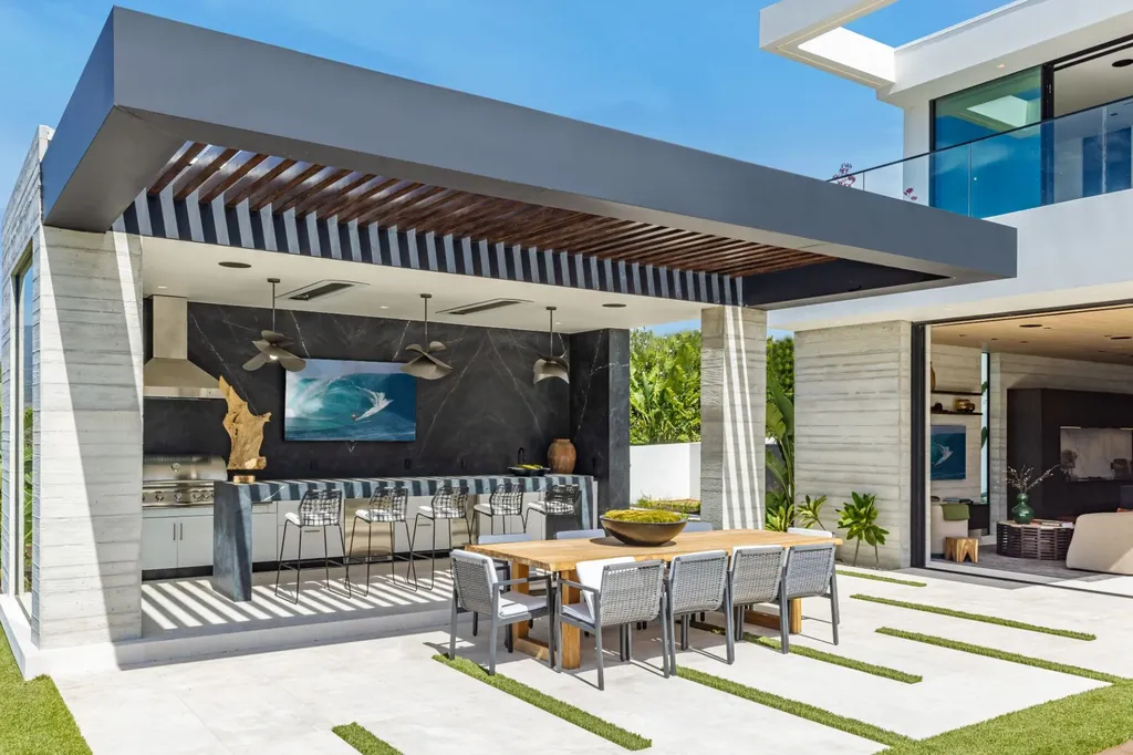 6889 Dume Drive Home in Malibu, California. Immerse yourself in the epitome of Malibu living with this newly completed 8,500 SF modern organic retreat in Little Dume. Developed and designed by Charles Kotliar and architect Doug Burdge, this ocean-view oasis offers 6 BD, 8 BA, customizations like board form concrete walls, oak woods, and curated stones. 