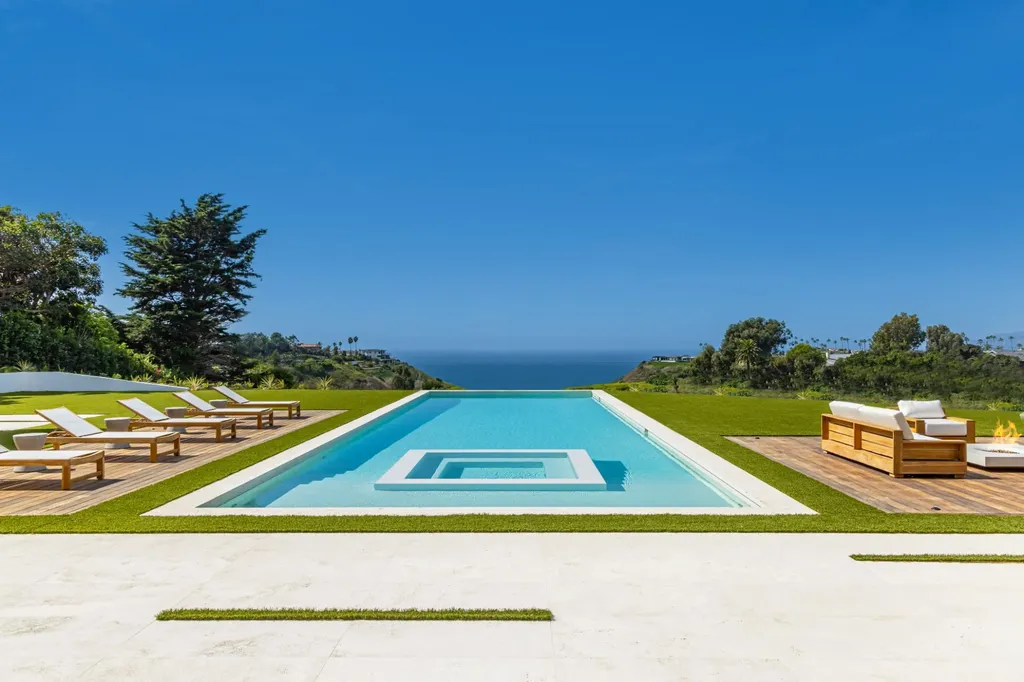 6889 Dume Drive Home in Malibu, California. Immerse yourself in the epitome of Malibu living with this newly completed 8,500 SF modern organic retreat in Little Dume. Developed and designed by Charles Kotliar and architect Doug Burdge, this ocean-view oasis offers 6 BD, 8 BA, customizations like board form concrete walls, oak woods, and curated stones. 